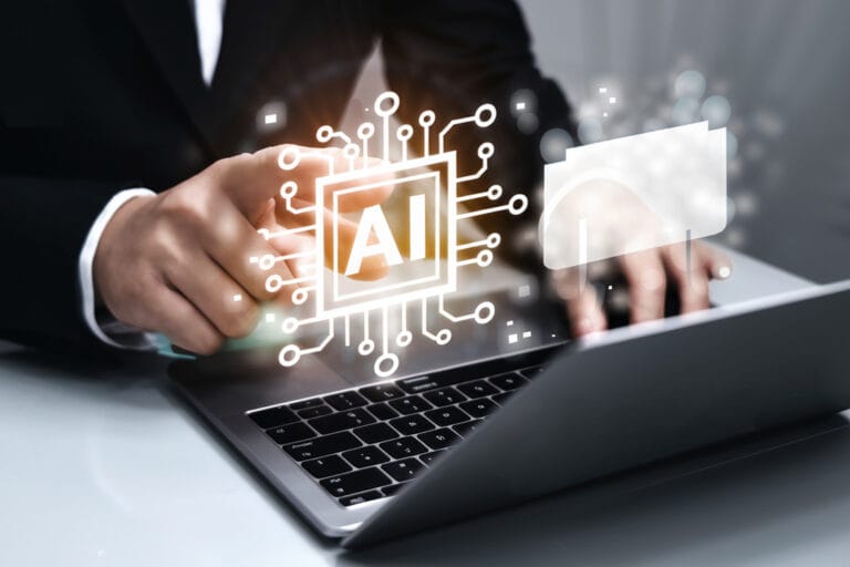 ai-generate-concept-artificial-intelligence-content-generator-tool-man-uses-laptop-with-ai-assis - NIHCF - NIHCF - NIHCF Hands typing on a laptop with glowing AI circuit graphics projected over the keyboard to symbolize artificial intelligence innovation